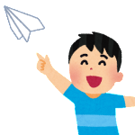紙飛行機を飛ばす子供
